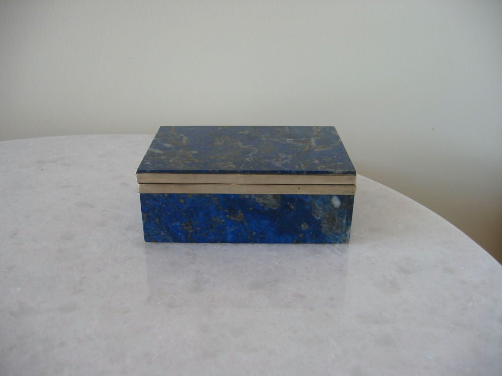 Box of solid lapis with sterling silver rims. Signed and dated by artist in Chile. Very chic with natural ware on the rims. Lapis in perfect condition.