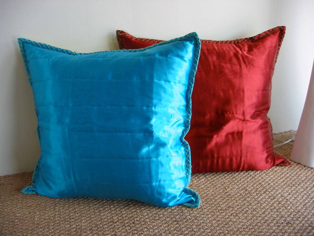 These two large throw pillows of Italian Anichini silk in luscious colors are with down insert pillows.. Felt top stitching boarders. Excellent clean condition--never used although some stitching on boarders is loose. Sold as a pair. The back is a