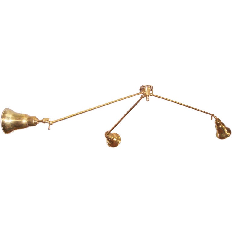 A Three-Arm Brass Ceiling Mounted Light Fixture