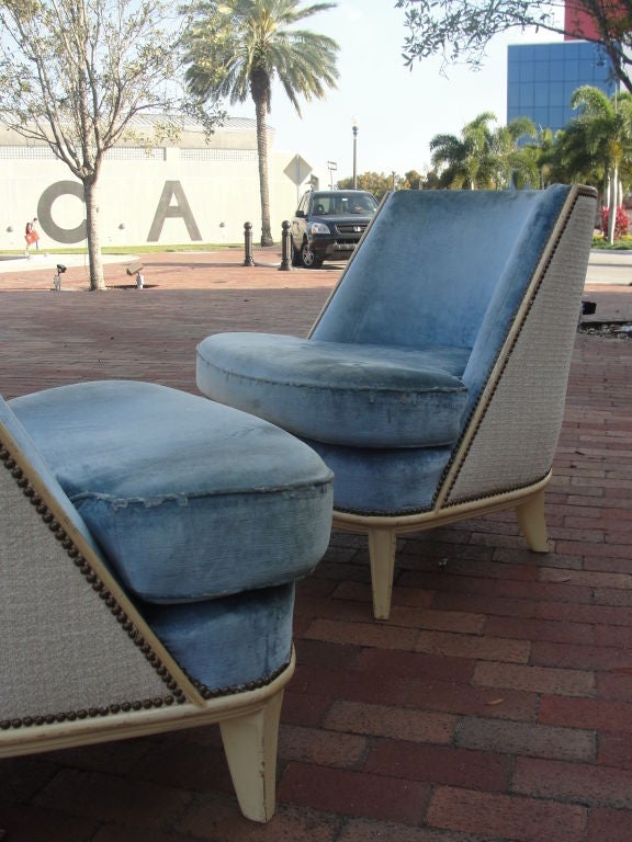 These chairs are wonderfully designed with studded trim and smart curves and kick-back feet.  They have been left in their original condition so that the buyer may select their preferred fabrics.  Upholstery can be done for additional cost.<br