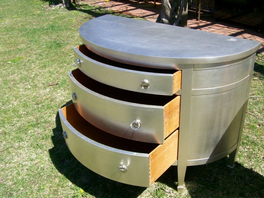 Pair of Silver-Leaf Demi-Lune Chests of Drawers