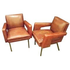 A Pair of Modernist Armchairs in Leather by Jacques Adnet
