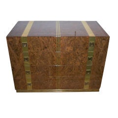 A Four Drawer Commode in Burl Wood and Brass
