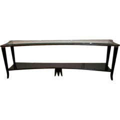 A Long and Low Modernist Console in Black Lacquer and Glass