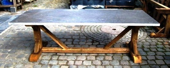 This dining table is made from reconstituted late 19thC or early 20thC barnwood planks. The wood has been bleached and waxed. The top is Belgian bluestone.