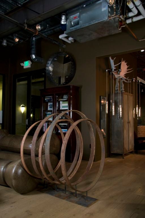 Amish buggy wheels translated to sculpture <br />
like upturned hoola-hoops of agrarian romance<br />
each balanced atop a steel stand<br />
sold individually or in quantity up to five<br />
<br />
dimensions front to back:<br />
48” H x 40”
