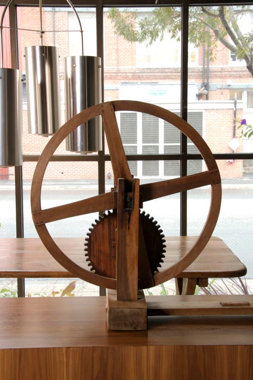 an example of mahatma ghandiâ??s sure-fire spin 
for indiaâ??s independence over the crown
this silk spinning wheel of teak 
rings in as industrial design in truth