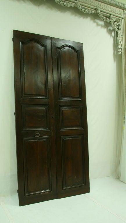 Pair of 19th century French walnut doors (another pair available).