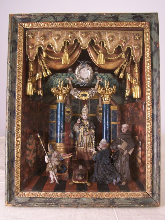 Very elaborate shadowbox with painted and parcel gilt interior. Figures are made of painted paper and fabric. Great detail.