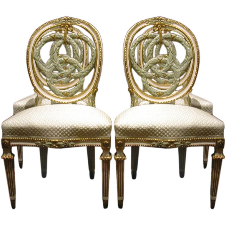 Set Of Four Italian Neoclassic Painted And Gilt Chaises For Sale