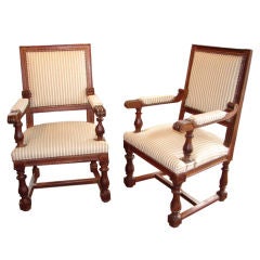 Pair of carved wood arm chairs