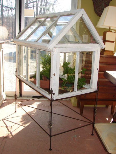 Charming large scale painted wooden hothouse on iron stand with finials.