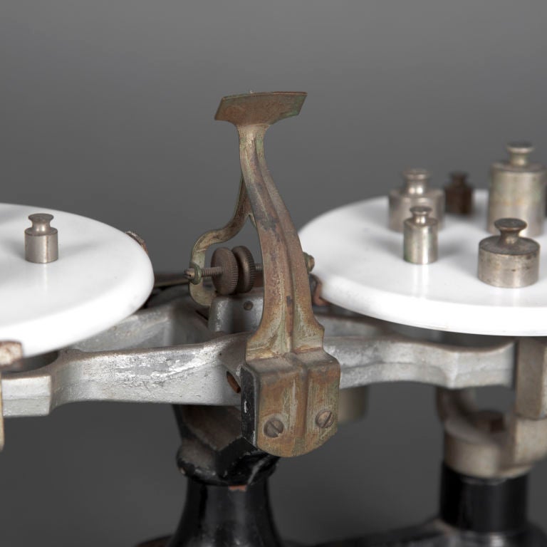 A beautiful example of early 1900's weights and balance scale, with functioning parts and original weights. Perfect prescription for your mechanical curiosity.