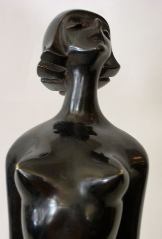 This large modernist nude bronze was designed and executed by Roland Paris. It was produced in the 1920's. It is signed in the casting, Roland Paris. It is very unusual to find a nude by Roland Paris, especially one of this size. Roland Paris was
