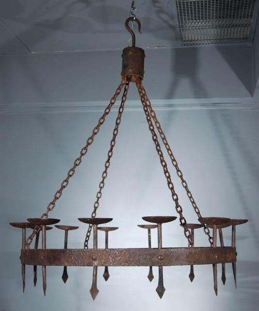 A Pair of Wrought Iron Chandeliers