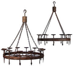 A Pair of Wrought Iron Chandeliers