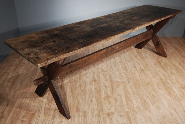 A French Stained Pine Sawbuck Table, Early 20th Century