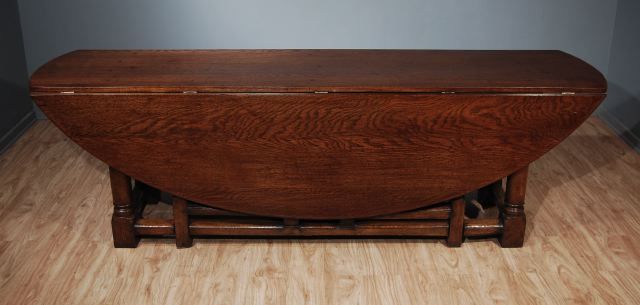 A Large Italian Stained Oak Gate Leg Table, Northern Italy