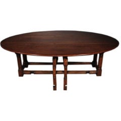 A Large Italian Stained Oak Gate Leg Table, Northern Italy