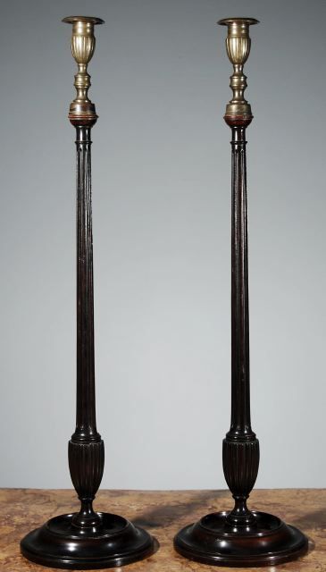 A Pair of Belgian Mahogany and Brass Tall Candlesticks