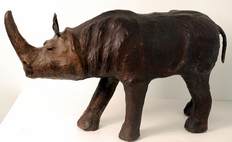 Hand crafted Leather Rhino footstool with glass eyes. These are hand made in England since 1927. It is functional, masculine, a bit whimsical