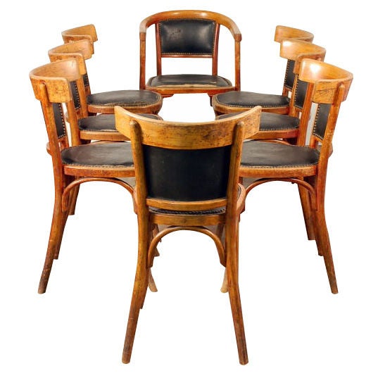 Set of 7 + 1 French bistro early 20th century dining chairs