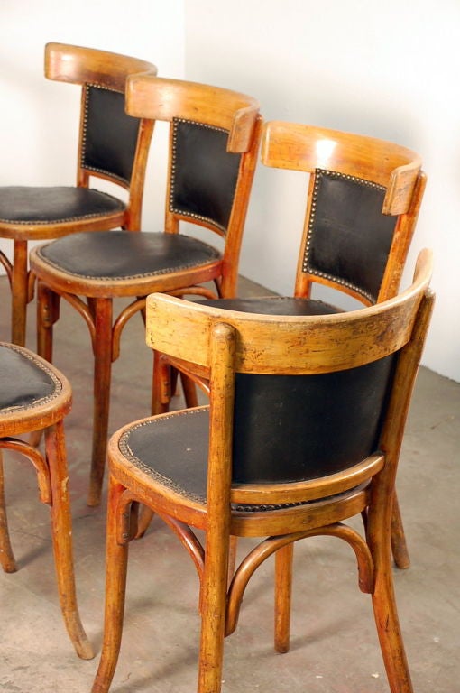 20th Century Set of 7 + 1 French bistro early 20th century dining chairs