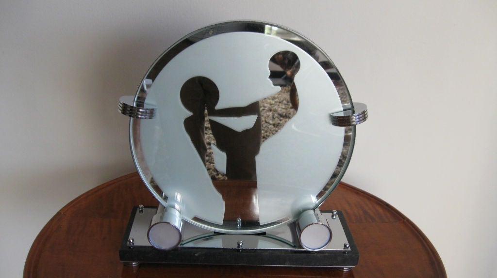 SINGLE ART DECO TABLE LAMP, CHROME PLATED, ROUND MIRRORED GLASS SHADE WITH A WOMAN'S IMAGE HOLDING A BALL AND SITTING ON A STOOL. SIGNED ON MARBLE BASE Z & Z.
