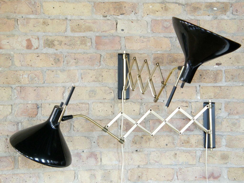 Wall mount lamps deigned by Gerald Thurston for Lightolier. Adjustable positioning and depth, a nice industrial application applied to residential lighting. <br />
Great for night stands or end tables.