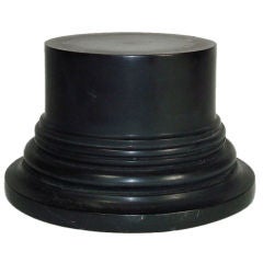 Sculpture of a column base in black marble from France.