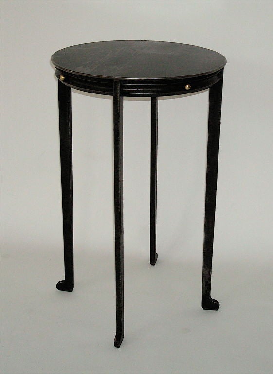 Cold rolled steel cigarette or drink table in a stylized neo classical design with brass accents. Signed Will Stone. Polished and blackened steel.