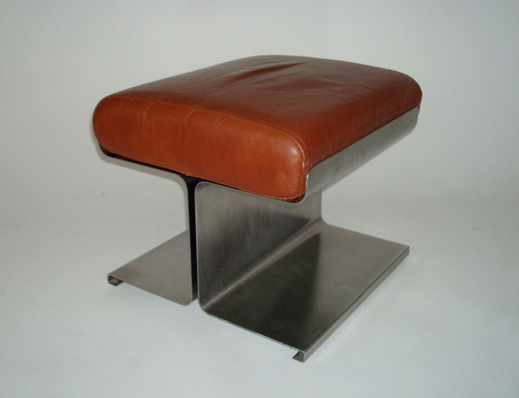 Stainless steel stool with cognac colored leather cushion by french designer Francois Monnet who was an expert at using folded stainless steel.