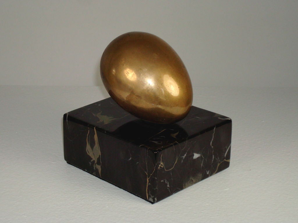 Solid bronze oval form by sculptor Varujan Boghosian b 1926 mounted on marble.