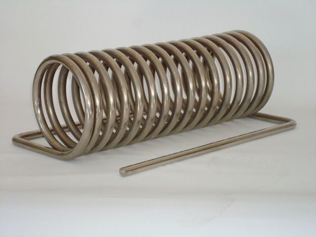 Yonel Libovici chrome-plated steel spring or ressort desk accessory made for holding paper. It was produced in two sizes, this example is the large size.