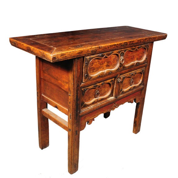 A 19th century Chinese elmwood chest with three drawers, iron studs and simple floral carved apron.<br />
<br />
Pagoda Red Collection #:  Y058<br />
<br />
<br />
Keywords:  Chest, table, nightstand, bedside, dresser, commode
