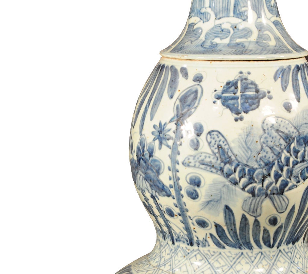A pair of monumental Chinese blue and white porcelain double-gourd urns with underwater fish and lotus motif.<br />
<br />
Pagoda Red Collection #:  Y008<br />
<br />
<br />
Keywords:  Urn, jar, vase, pot, vessel, planter, bowl, garden,