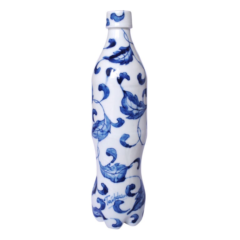 A set of six hand painted, blue and white underglazed porcelain cola bottles by Taikkun Yang Li (1981-Guangzhou, China). Taikkun's work crosses the boundaries of design, sculpture, ceramics, film, and photography. His projects are extensively