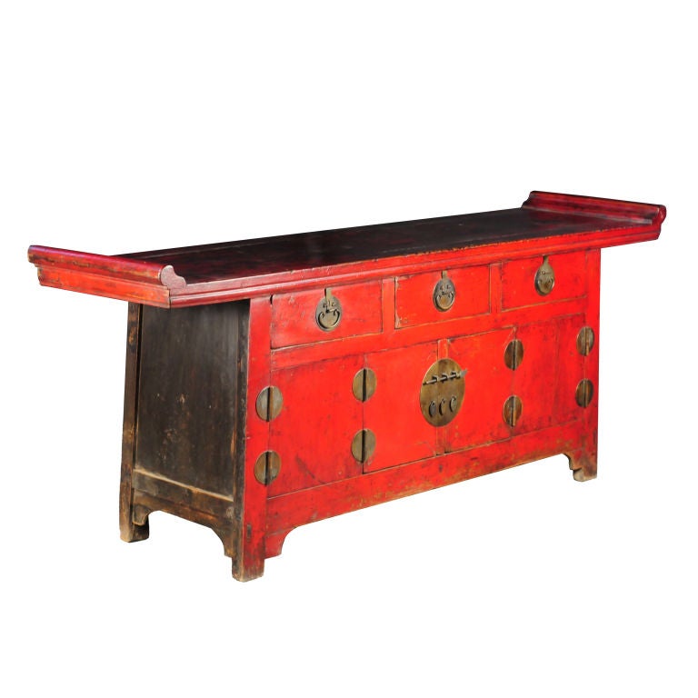 An early 19th century Chinese elmwood altar coffer with three drawers, bi-folding doors, brass hardware and original red lacquer.<br />
<br />
Pagoda Red Collection #:  Y082<br />
<br />
<br />
Keywords:  Coffer, sideboard, buffet, credenza,