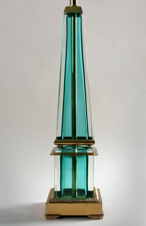 This is an unusual lamp in a gorgeous color. Bronze fittings are interspursed between the pieces of glass. It measures 36.