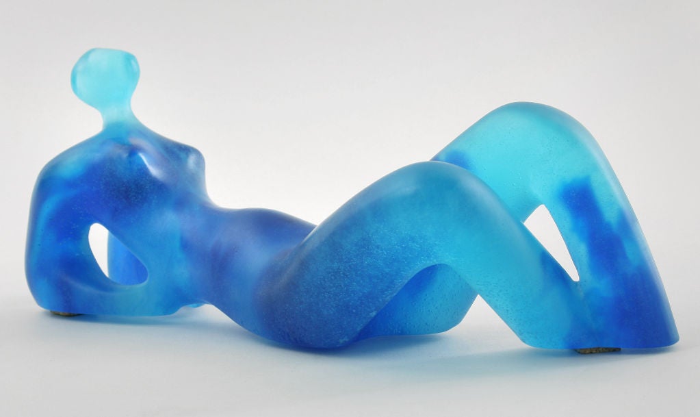 This is a beautiful reclining nude made for Daum by. It has a very Henry Moore feel.  It is number 148 out of the limited edition.