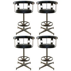 Pair of   swivel bar stools with strap details