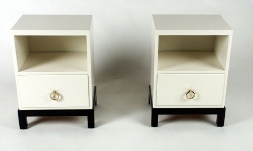 Pair of night stands with brass ring hardware, lacquered bodies on parson's legs with single drawer below storage cube. Currently being refinished, lacquer colour or wood stain can be specified.