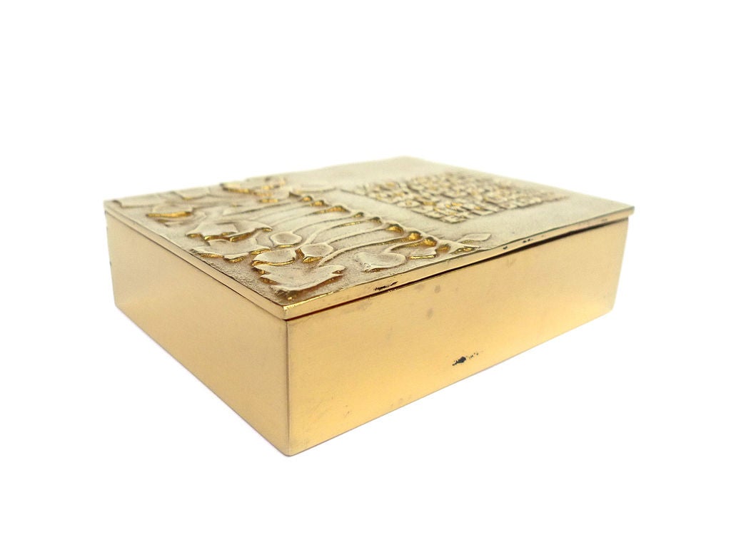 A gilded bronze box inspired by a Guillaume Appolinaire poem. Signed Line Vautrin. Certificate of authenticity by Vautrin's daughter Marie-Laure Bonnaud Vautrin.