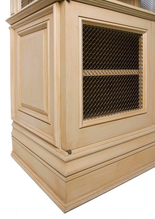 Wonderful pair of bookcases with lower cabinetry with mesh wire.