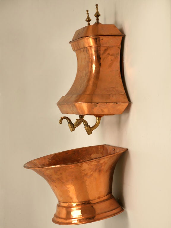 Stunning 18th century antique French solid copper lavabo set-- have this beauty plumbed as a fabulous statement in a powder room or as a fountain in an all seasons room. In outstanding condition, this beauty has recently been polished showing loads