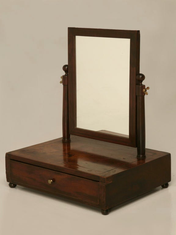 Phenomenal antique English Mahogany gentleman's shaving stand with a wonderful divided drawer. Utilized on the tops of dressers and bureaus, these were once very common. Now somewhat scarce, these once utilitarian stands are quite collectible,