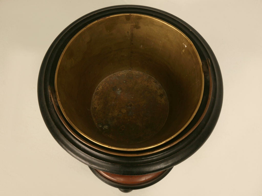 Phenomenal antique Dutch mahogany treen peat bucket with ebonized accents and original brass bucket. When our buyer saw this bucket, she knew immediately it would be awesome utilized as a planter, a wine cooler, or a variety of ways, she is one
