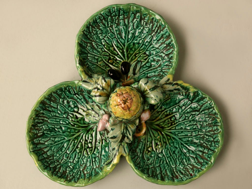 Remarkable vintage French Majolica serving plate with a center covered artichoke-form sauce container. Use this beauty at your next party and amaze all your friends not only with your scrumptious homemade delectables, but with your exquisite taste