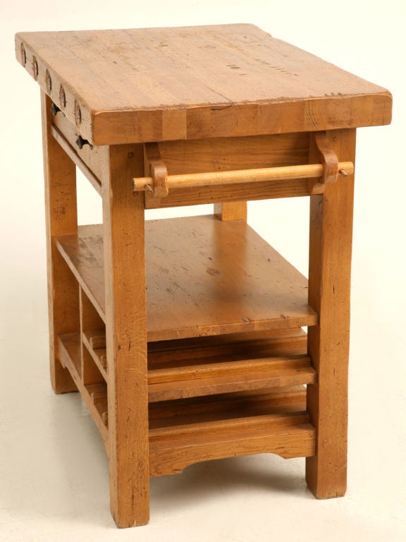 Vintage American butcher's block topped solid oak table/island, with double towel bars, 2 shelves with wine/bottle storage, and 2 pass-through drawers, to boot. Very sturdy with solid construction, this table has the opportunity to become one of