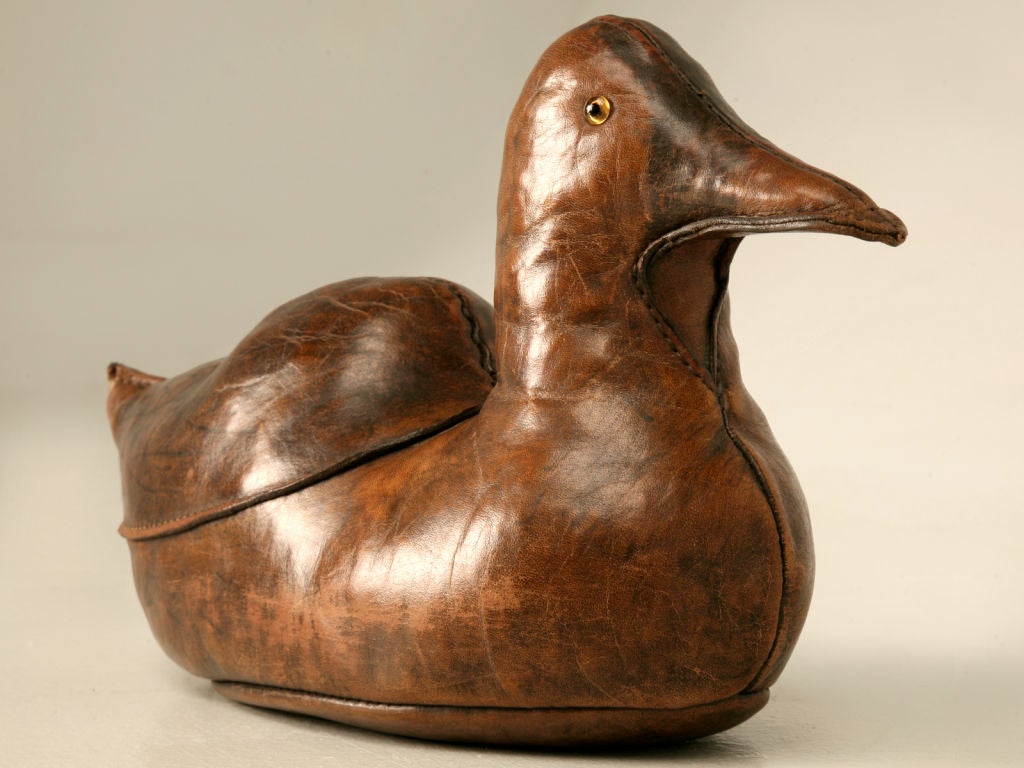Cool vintage English leather duck doorstop. The perfect accessory for that gentleman in your life. This duck, not only offers aesthetic beauty, but it takes it to an all new level. Awesome in a library, an office, or functioning as originally